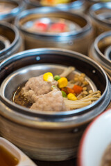 Close up dim sum chinese food in bamboo basket on a dining table, dim sum, Thailand
