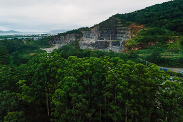Quarry excavation and mountain in Florianopolis. Drone view