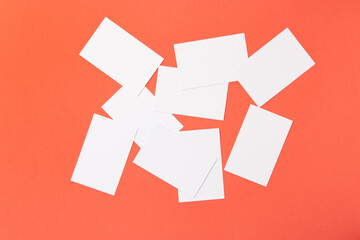 Mockup of white professional business card on orange background