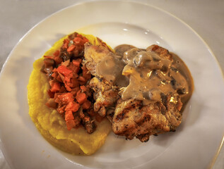 Grilled chicken legs with creamy mushroom sauce (with turmeric mashed potatoes and sautéed...