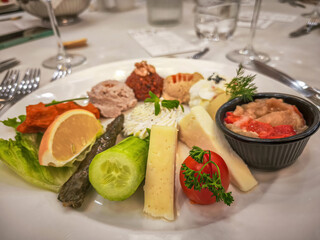 Hors d'oeuvre plate, Antep paste, Hummus, Haydari, Eggplant burial, Lemon, Cucumber, Tomato, Ezine cheese, Izmir tulum cheese.