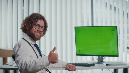 A Doctor Sits in His Modern City Office, Working on a Computer with a Green Screen. He Delivers High-Quality Medical Services, Tailoring Care to Their Fast-Paced Lifestyles. Concept of Healthcare