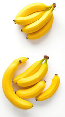 Macro shot of yellow bananas in various sizes creating an interesting visual contrast on a white surface, ingredient, farmhouse, selection, diversity, different