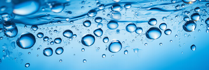 Macro Water Drops in Clear Blue Liquid.