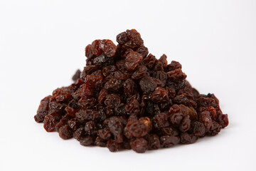 Fototapeta premium Pile of Dark Raisins on White Background