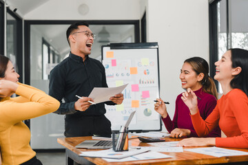 Engaged team meeting with diverse professionals sharing ideas and laughter. atmosphere is lively and collaborative, showcasing teamwork and creativity