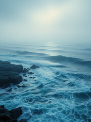 Obraz premium Misty sea scene with ocean waves crashing against the shore, abstract background, sea