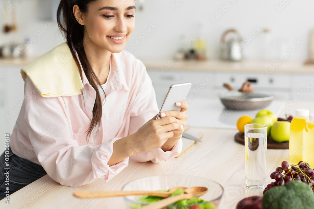 Fototapete modern technologies and lifestyles concept. portrait of cheerful young female using cellphone while 