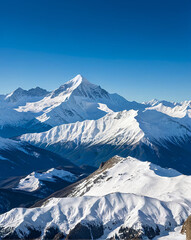 Obraz premium high mountains with snow on them, against the background of a blue sky