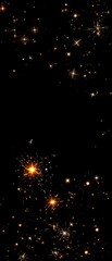 Obraz premium Fire sparks suspended in mid-air with varying sizes and shapes on a black surface, scorching shards, varying size sparks, pyrolysis fragments, thermal fragments, hot sparks.