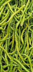 Pointed peppers piled up for sale at a vegetable market