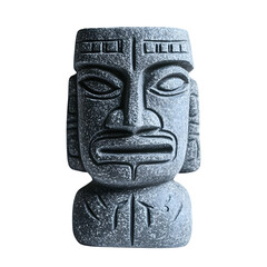 A close-up view of a carved stone head statue with intricate tribal designs