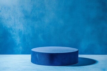 Blue rounded podium on a bright blue background. Minimalistic photo style.