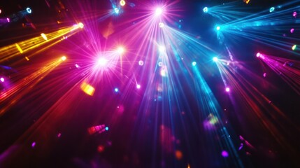 Fototapeta premium A dazzling disco light display with vibrant beams of color reflecting across a dark room, creating a lively party atmosphere. Captured in stunning full HD quality.