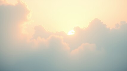 Fototapeta premium A soft golden sun peeking through a veil of ethereal clouds, creating a serene and dreamy sky.