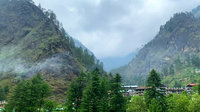 Small villages and colorful local houses nested in the hills of parvati valley at manikaran, himachal pradesh, India.
