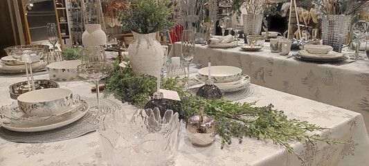 Trendy Christmas decor on family table, trendy Christmas decorations in shop window, 2025 trends in...