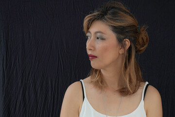 Portrait of face asian woman on black cloth background.