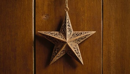Naklejka premium A small, wooden Christmas star, carved with intricate details, hanging from a rustic, wooden door.