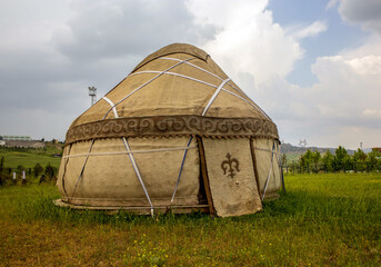 old traditional nomadic turkish tent house (yurt) on the grass