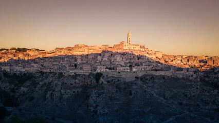 Ancient city on hill side with levels of limestone houses and tiled roofs, Matera, Basilicata, Italy