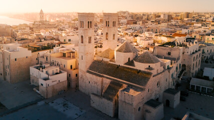 Aerial view old Mediterranean coastal city with big cathedral on sunny day, Molfetta, Puglia, Italy