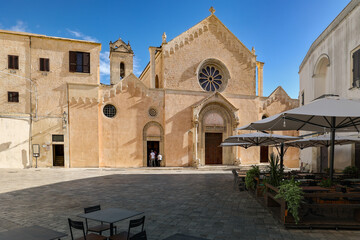 Small Southern Italian old town center with basilica di santa caterina, Galatina, Puglia, Italy