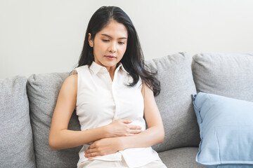 Flatulence ulcer, asian young woman, girl hands in belly, stomach pain from food poisoning, abdominal pain and digestive problem, gastritis or diarrhea. Abdomen inflammation, menstrual period people.