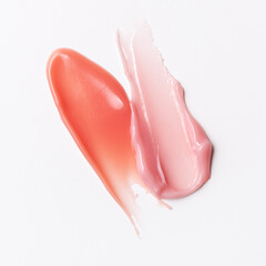 Pink or light red lipgloss texture isolated on white background