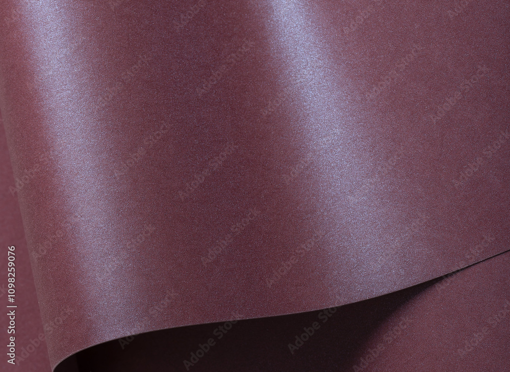 Poster metallic burgundy paper background with a sleek, glossy surface and soft shimmer. featuring refined 
