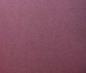 Fototapeta premium Metallic burgundy paper background with a smooth, shimmering surface and sleek, glossy sheen. Featuring rich, deep tones and a subtle gradient, it exudes elegance and