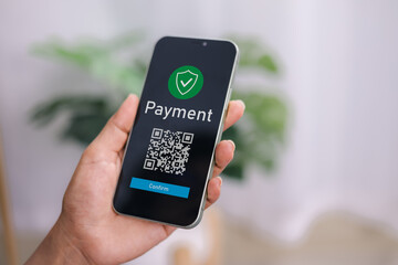 Hands holding mobile phone, Qr code payment or cashless technology concept. Coffee shop accepting digital pay without money, Meaningless QR code, Hand using mobile phone application to scan qr code.