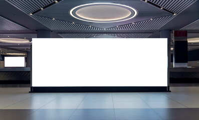 Mockup template of a large blank billboard banner in a modern shopping mall or airport terminal,...