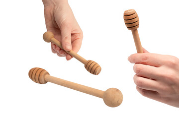 Honey dipper in woman hand isolated on a white background.