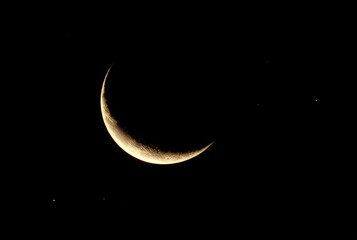 C &ndash; A crescent moon with stars scattered around it