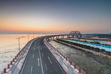 Obraz premium Beautiful Panoramic Sunrise in Surabaya Bridge Kenjeran which was photographed from the pedestrian bridge. 
