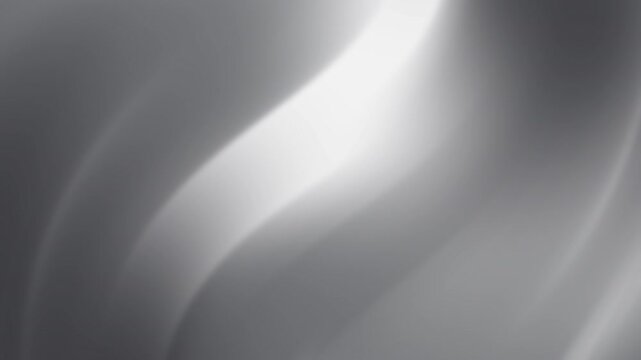 Abstract silver gradient image with flowing, light and shadow effects.