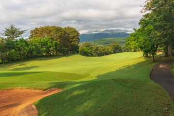 Obraz premium Panorama View of Golf Course with putting green in Taman Dayu Pandaan, Pasuruan, East Java, Indonesia. Golf course with a rich green turf beautiful scenery.