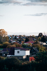 View from a distance of the town in autumn. Houses in the distance.