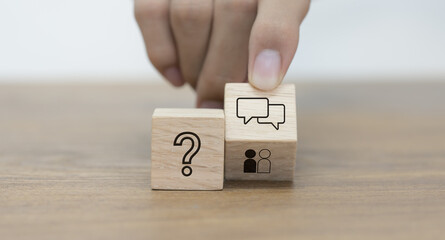 The Q&A idea. Q and A symbols are shown on a wooden cube block. An example of a frequently asked question topic in social media, internet, and commercial matters. notion of recommendation.