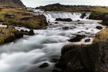 A beautiful Icelandic waterfall flowing dramatically over cliffs