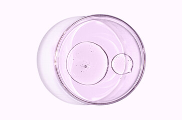 Skin serum or body gel in a Petri dish. Cosmetic product