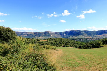 Fototapeta premium Landscape of Millau, France. Mountains and blue sky with white clouds, Gorges du Tarn
