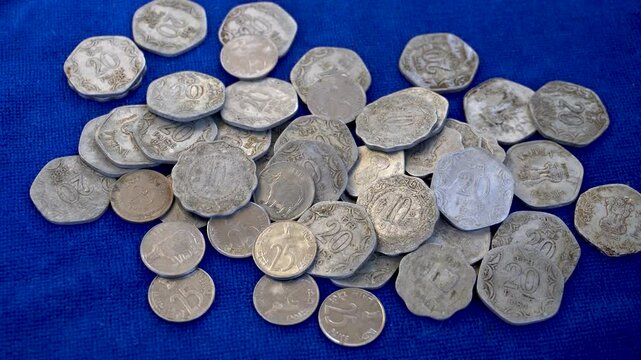 Close shots of old Indian coins of five ten and twenty paisa 1