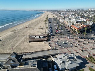 Newport Beach, California, November 20. 2024: New poer Beach, California, In Fall looking at kids at the piwe tht replaced the Mcfadden Wharf and the Pier Plaza from a UAV Drone