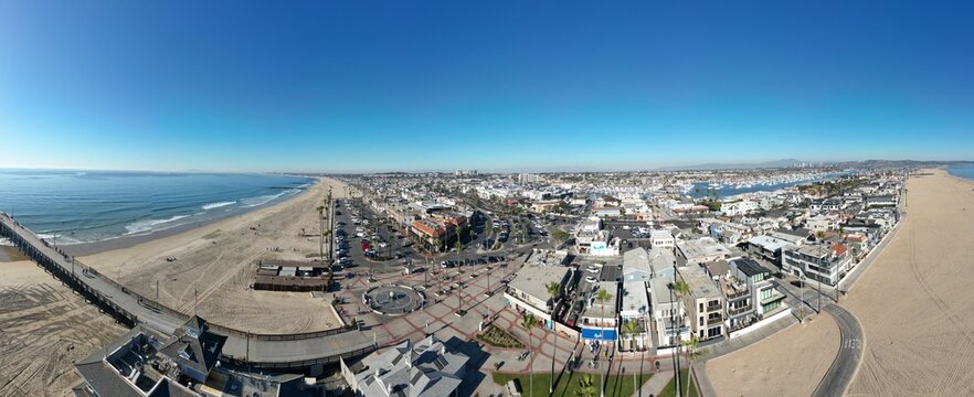 Newport Beach, California, November 20. 2024: New poer Beach, California, In Fall looking at kids at the piwe tht replaced the Mcfadden Wharf and the Pier Plaza from a UAV Drone
