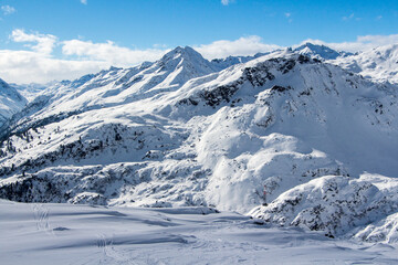 Fototapeta premium Beautiful winter day in Vorarlberg, snowy mountain landscape, Tirol, Austria. Ski paradise destination St Anton, Lech, Zurs