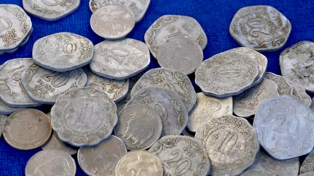 Close pan shots of old Indian coins of five ten and twenty paisa 2