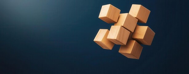 Human resources concept. Floating wooden cubes against a dark background, ideal for illustrating concepts of structure and creativity.