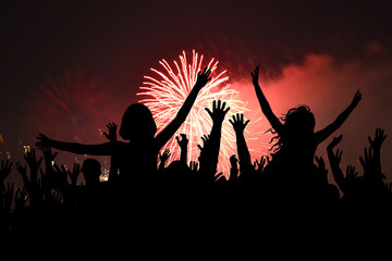 Happy people partying at New Year's or a concert